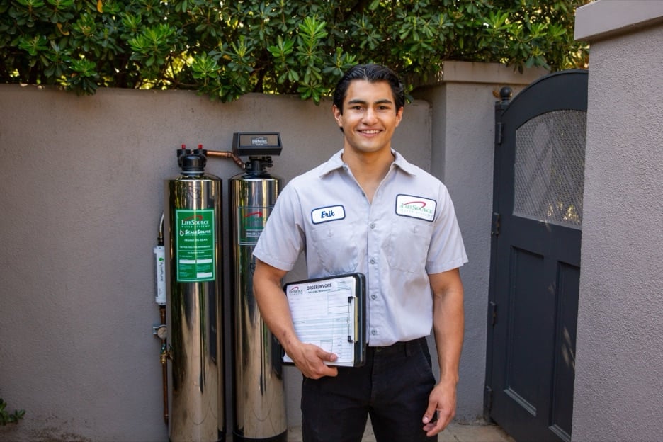 LifeSource installer standing beside an installed system