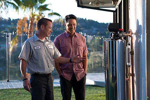 men viewing water system