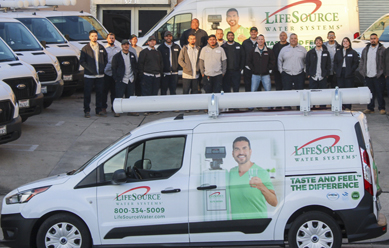 lifesource team outside next to their vans