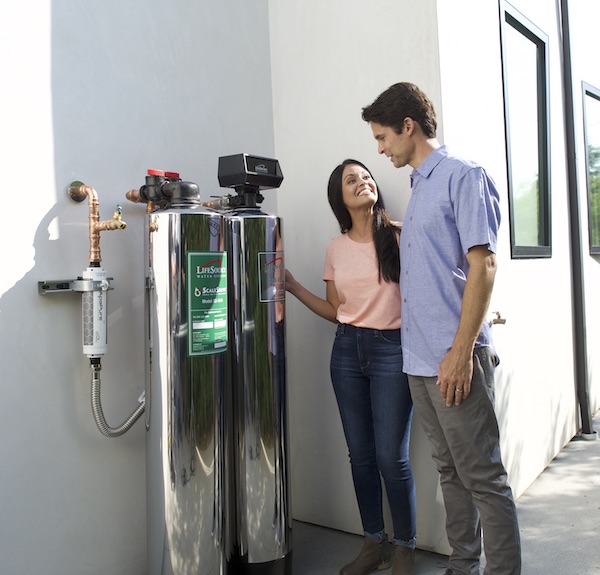 Couple happy to see their LifeSource water softener alternative system