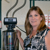 Cynthia showcasing her water tank