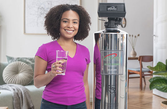 a customer standing next her water tank