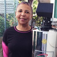 a women next to lifesource water tank