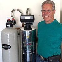 a gentleman next to lifesource water tank